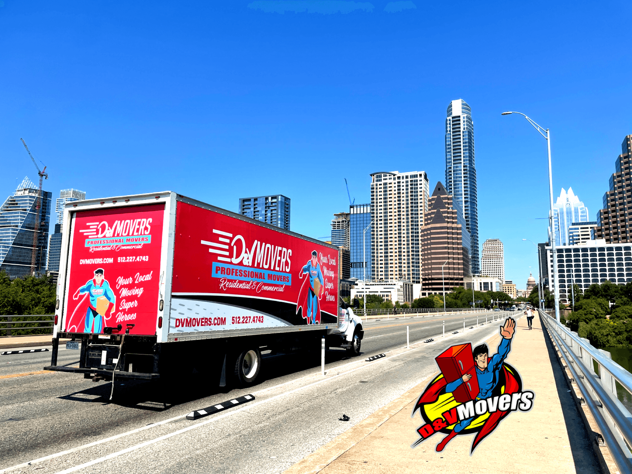 A D&V Movers truck driving through downtown Austin